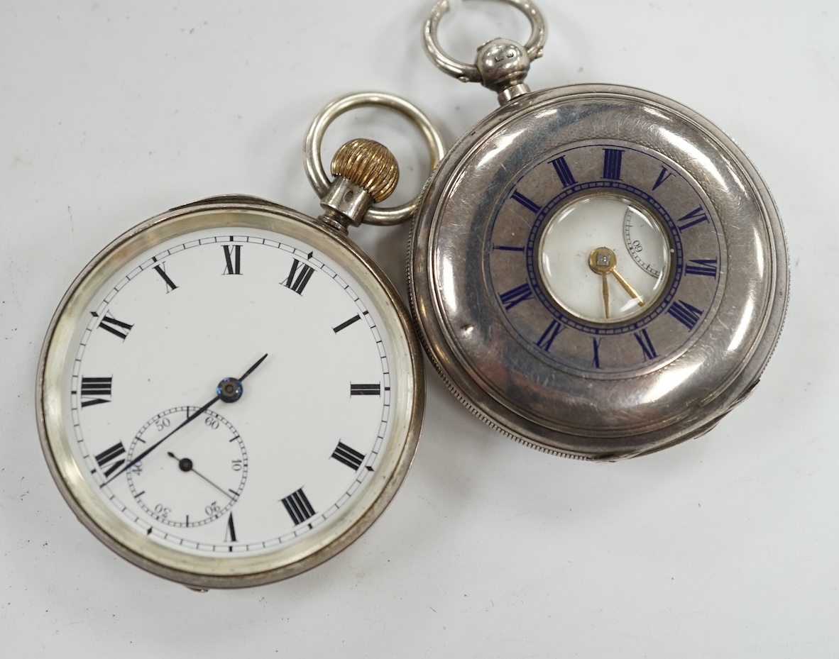 A late Victorian silver half hunter pocket watch and a later silver open faced pocket watch. Condition - poor to fair